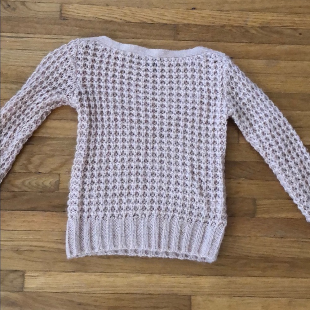 A pink sweater